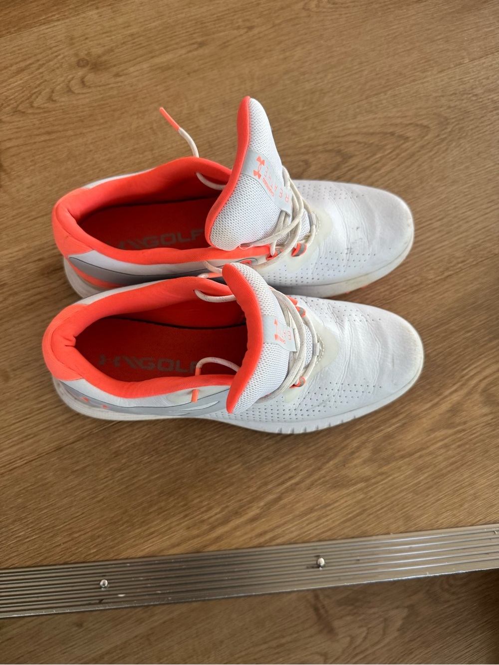 Under Armour women’s White and Coral golf shoes